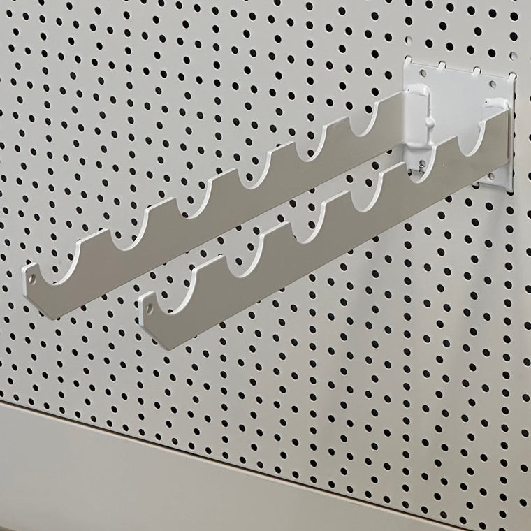 Spade or fork holder for perforated back panel