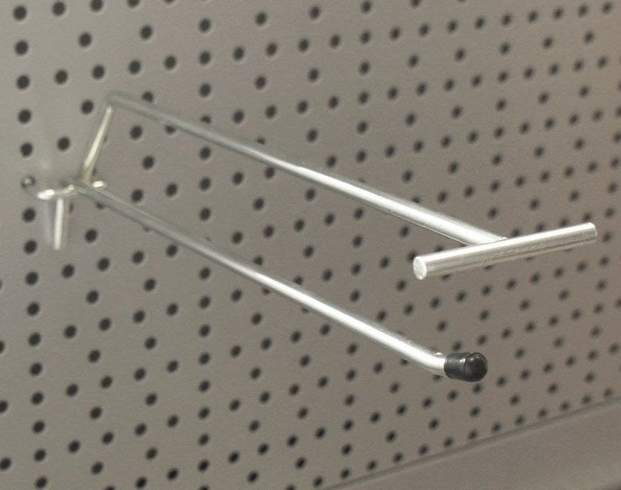 Single prong peg hook with overhead arm